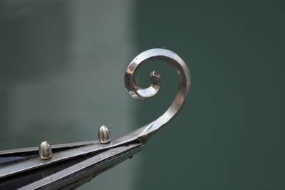A metal risso on the stern of a gondola on the Grand Canal in Venice, Italy, Europe