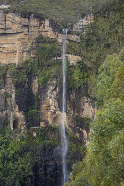 Bridal Veil Falls at Govetts Leap Lookout a waterfall dropping 180m down into Grose Valley below in the Blue Mountains - a region west of Sydney in Australia’s New South Wales with steep cliffs and eucalyptus forests, Australia