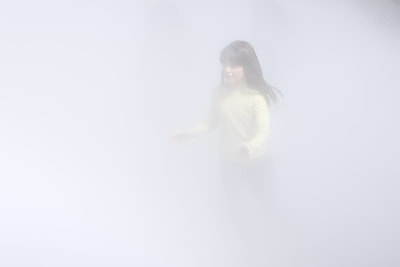 A young child walks through the 'London Fog' art installation by Japanese artist Fujiko Nakaya at the Tate Modern art gallery in London United Kingdom