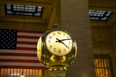 Travellers in the main concourse near the clock in of Grand Central Terminal (GCT, Grand Central Station, Grand Central) a commuter and intercity railroad terminal at 42nd Street and Park Avenue in Midtown Manhattan in New York City, United States of America USA U.S.A.