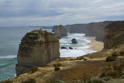 The Twelve Apostles with surf, a collection of limestone stacks off the shore of the Port Campbell National Park, by the Great Ocean Road in Victoria, Australia