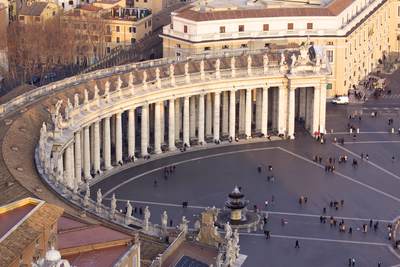 Gian Lorenzo Bernini's  colonnade around Piazza San Pietro viewed from the top of St Peter's (Basilica di San Pietro), in the late afternoon sun in Rome, Lazio, Italy Europe