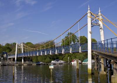 Teddington footbridge over the river Thames on a sunny day in Middlesex in the United Kingdom