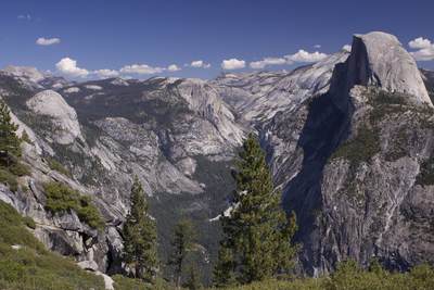 View down to Yosemite Valley from Glacier Point with Half Dome on the right in Yosemite National Park in California in the United States of America in the USA U.S.A.