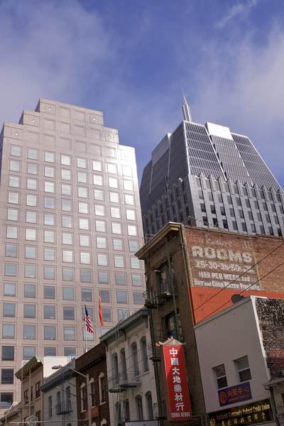 Modern buildings in the Financial District next to original early 19th century brick buildings in the China Town district in San Francisco in California in the United States of America USA U.S.A.