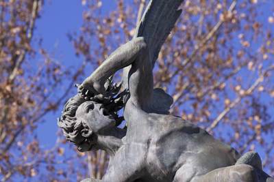 A bronze sculpture of 'The Fallen Angel', by Ricardo Bellver (1845-1924), a Spanish sculptor, located at Plaza del Ángel Caído, in Retiro Park (El Retiro, Buen Retiro Park, Jardines del Buen Retiro, Parque del Buen Retiro) in Madrid, Spain Europe