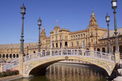 Plaza de España, a semicircular complex designed by Spanish architect Anibal González as the centrepiece of the Spanish Americas fair in 1928, located in the Parque de María Luisa in Seville, Andalucia, Spain Europe