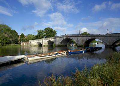 An morning view of Richmond Bridge in early summer over the river Thames in the London Borough of Richmond in the United Kingdom