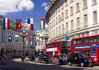 Regent Street with London buses, London taxis and Olympic flags in the United Kingdom