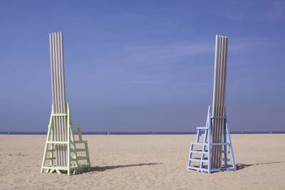 A public art sculpture by Douglas Hollis called 'Singing Beach Chairs' created in 1987 out of painted stainless steel with anodised aluminium wind-pipe organs (5.5 metre, 18-foot high), located on Santa Monica beach near the pier in Los Angeles, California, United States of America USA U.S.A.