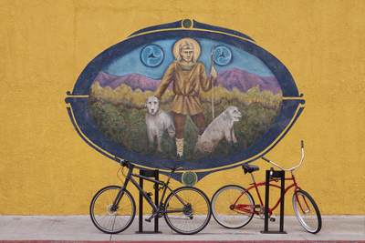 Mural on a side wall of Ann McCool's irish pub on Hill Street, with bikes parked in front in Santa Monica in Los Angeles, California, United States of America USA U.S.A.
