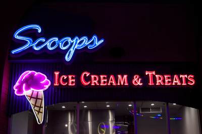 'Scoops' ice cream parlour lit by neon at night, on the Santa Monica Pier in Santa Monica in Los Angeles, California, United States of America USA U.S.A.