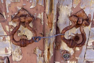 Rusted door handles on an old door in Baleal, Obidos Portugal Europe