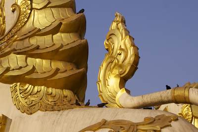 30 foot high 'Chinthe' (half-lion and half-dragon guardian figure) overlooking entrance to the south gate of the Shwedagon Pagoda (Shwedagon Zedi Daw) - this current form dates from 1769 in Yangon (Rangoon) in Myanmar (Burma)