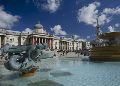 View across Trafalgar Square with the National Gallery in the background and fountains in central London in the United Kingdom 