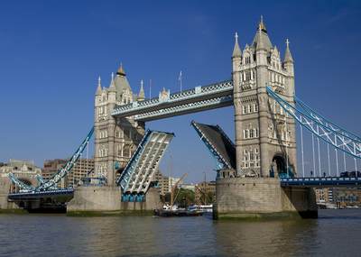 Tower bridge over the river Thames opens to allow ships to pass in central London in the United Kingdom