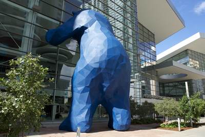 40-foot high sculpture of a blue bear made from steel and fibreglass titled 'I See What You Mean', (created by Lawrence Argent) leaning against the windows of the Colorado Convention Centre at 700 14th Street in  downtown Denver, Colorado in the United States of America USA U.S.A.