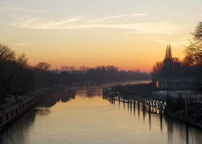 A view at dawn of the river Thames upstream from Teddington in the winter in Middlesex in the United Kingdom