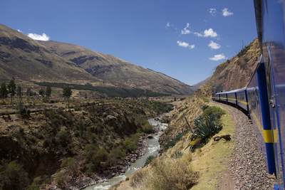 A view of the 'Andean Explorer' travelling along the standard gauge tracks of the railway line from Cusco Cuzco to Puno in Peru in South America