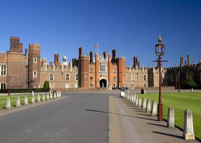 The drive up to the facade of Hampton Court Palace in East Molesey in Surrey in the United Kingdom
