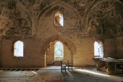 Ruins of an ancient Hamman (Turkish Bath House) with three wooden chairs, built in 1483 in the grounds of the Empress Zoe hotel in Sultanhamet district in Istanbul, Turkey, Europe